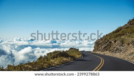 Hawaiian pass road above the clouds and to the skies, On the way to Haleakala Crater, Maui Hawaii Royalty-Free Stock Photo #2399278863