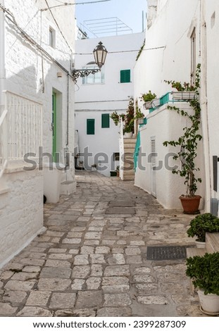 Ostuni, Italy - one of the most beautiful villages in South Italy, Ostuni displays a wonderful Old Town with narrow streets and alleys  Royalty-Free Stock Photo #2399287309