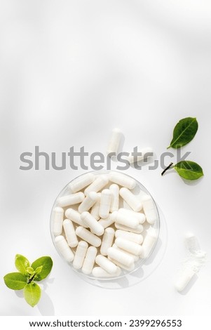White capsules with minerals or food additives with an organic composition. Vitamins. Copy space