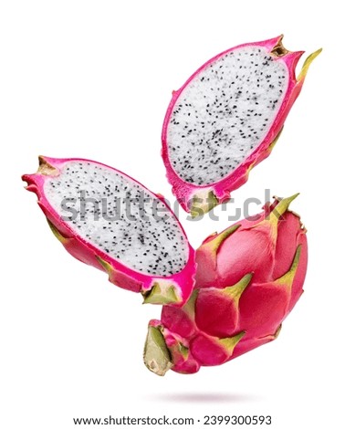 Dragon fruit and two halves falling close-up on a white background. Pitahaya isolated