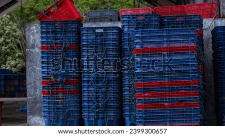 stacks of container baskets in the port fish auction area