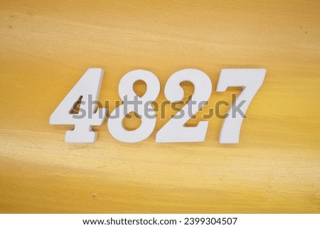 The golden yellow painted wood panel for the background, number 4827, is made from white painted wood.