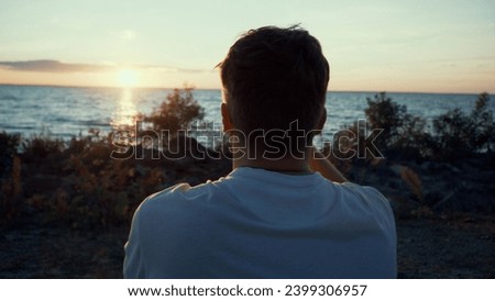 Man Tourist Enjoying Beautiful Sunset, Taking Photo