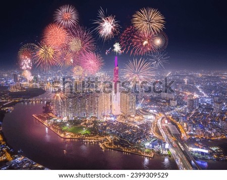 Celebration. Aerial view of Landmark 81 skyscraper with fireworks light up sky over business district in Ho Chi Minh City, Vietnam. Saigon bridge in night view. Holidays, celebrating New Year Royalty-Free Stock Photo #2399309529