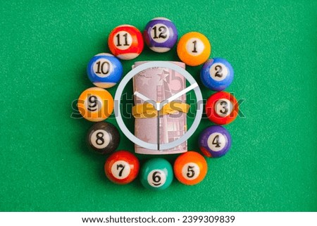 snooker,billiard balls on green table in circle like a clock face.wasting time.Top view.