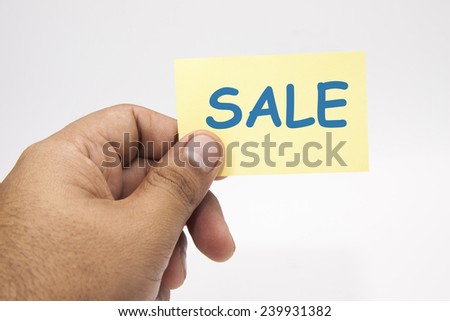 Yellow post it note with hand on white background.
