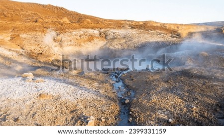 Geothermal Area in Iceland. Martian landscape at Sulfur Valley with Smoking Fumaroles. Famous tourist spot Hverir. Real Volcanic Activity near Myvatn lake. Evaporating water. Shot in high resolution.