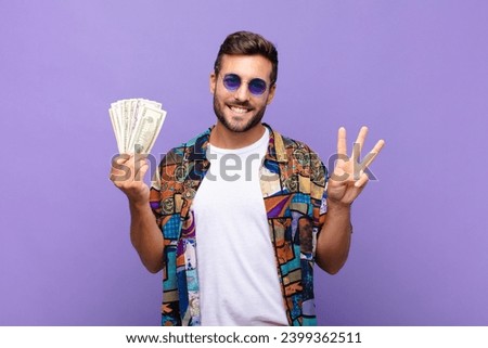 young man smiling and looking friendly, showing number three or third with hand forward, counting down. holidays concept