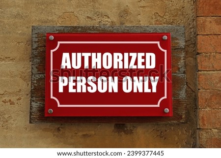 Sign with text Authorized Person Only on old wall