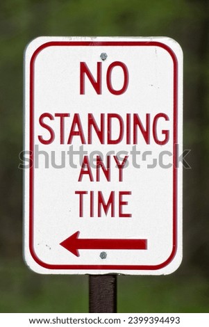 no standing any time sign red on white