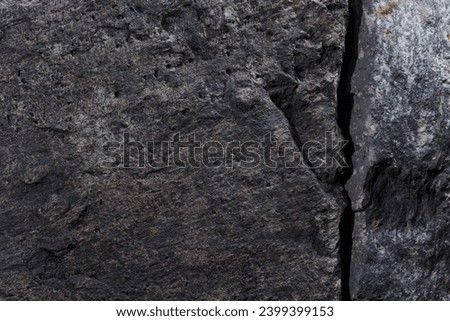 Gray stone texture, dark abstract background. Natural mineral rock close up details, empty backdrop with copy space for design