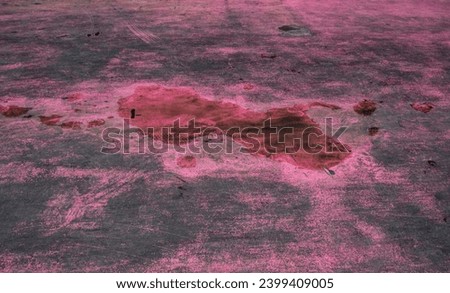 Small puddle on a pink floor