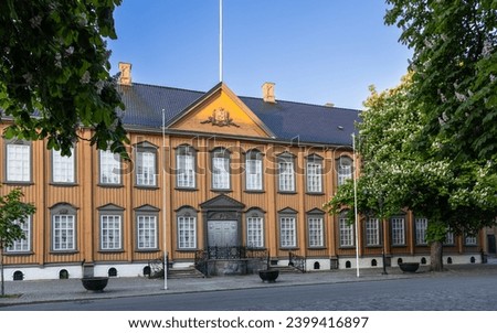 The Stiftsgarden facade in Trondheim, Norway, presents a magnificent 18th-century wooden palace, distinguished as Scandinavia's largest timber mansion and the Norwegian King’s official residence