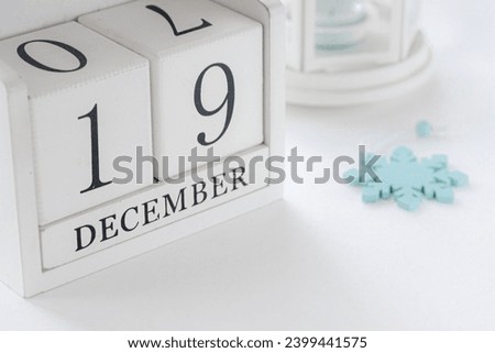 19 th December. White block calendar presents date 19 and month December, website events.  Winter decoration concept. Winter days.