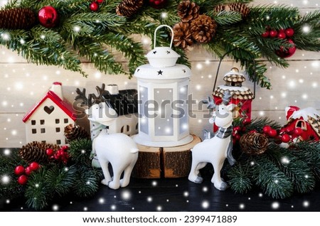 Holiday card, Merry Christmas and Happy New Year.  White deer on a Christmas background, branches of spruce houses and gentle snowfall.  Foreground.  Christmas and New Year holiday concept.