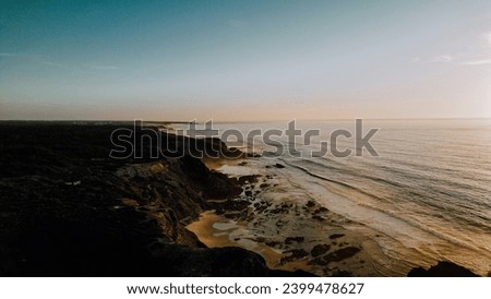 Portugal beach, panorama. Panoramic view of the sandy beach. The sea wave rolls on the shore. Sea coast view from the air. Aerial photography of the sea wave. The ocean and beach. Beach Coast.