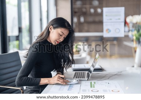 Beautiful confident asian business woman working with laptop Hands typing  keyboard. Professional investor working new start up project. business planning in office. Technology business.