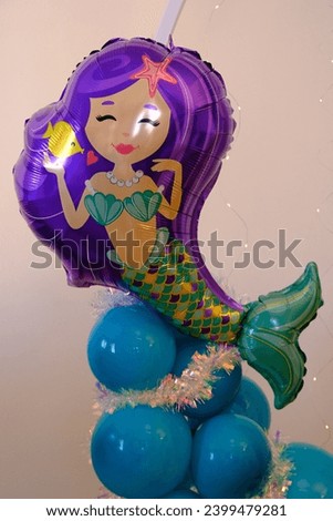 Birthday organization background and colorful mermaid balloon. Baby Shower celebration