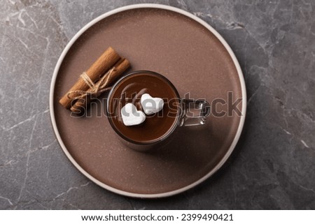 Top view on a cup of hot chocolate with marshmallows on a dark table.  Royalty-Free Stock Photo #2399490421