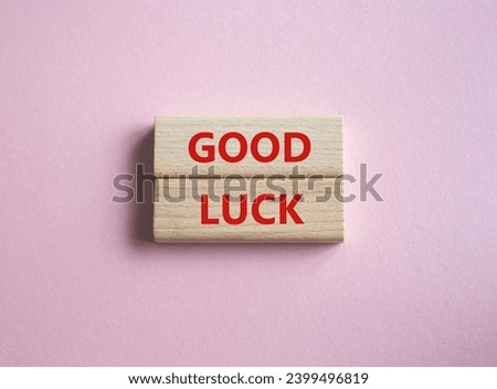 Good luck symbol. Wooden blocks with words Good luck. Beautiful pink background. Business and Good luck concept. Copy space.