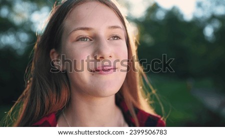 happy teen girl in the park. close-up of a girl in nature. happy family child concept. happy girl smiling with sun glare. portrait of a cheerful little girl. child outdoors in dream the park closeup