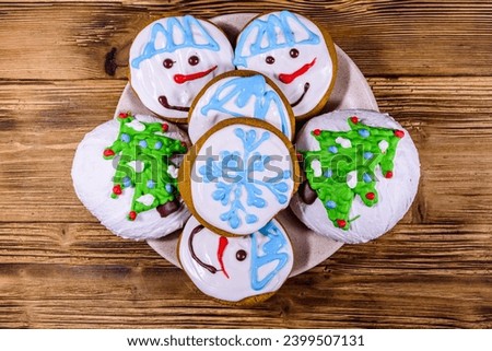 Christmas gingerbread cookies on a wooden table. Top view