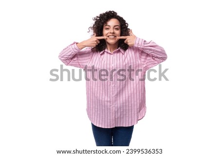 young successful businesswoman dressed in a striped pink shirt isolated on white background