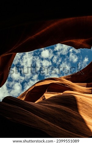 Look of water shaped smooth sandstone walls to unusual curves and adges in antelope national park in arizona, america, usa Royalty-Free Stock Photo #2399551089