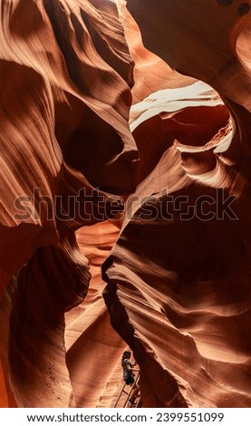 Look of water shaped smooth sandstone walls to unusual curves and adges in antelope national park in arizona, america, usa Royalty-Free Stock Photo #2399551099