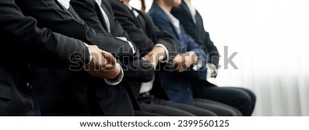 Panoramic banner business team sitting in line and join hand together symbolize successful business partnership and professional synergy for job employment, HR agency recruitment concept. Shrewd