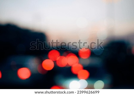 Colorful defocused bokeh abstract background created by city night lights. Blurred defocused colorful lights of traffic in the city. selective focus. An elegant and neatly arranged gift box on white b