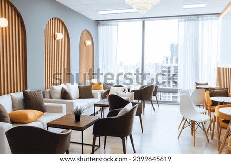 Empty stylish and modern office interior with skyscrapers view decorated with table, chair, botany decoration, elegant accessory. Living room. Modern interior. Creative design. Day light. Ornamented. Royalty-Free Stock Photo #2399645619