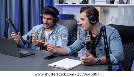 Host channel of smart influence broadcaster talking with new special guest at modern studio, streaming online greeting with listeners on social media live or radio. Concept of giving advice. Sellable.