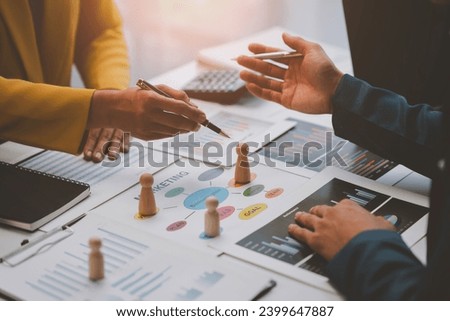 Business planning for marketing work, placing people, allocating employees in each department to work. with project planning documents on the conference table Human resources management concept.