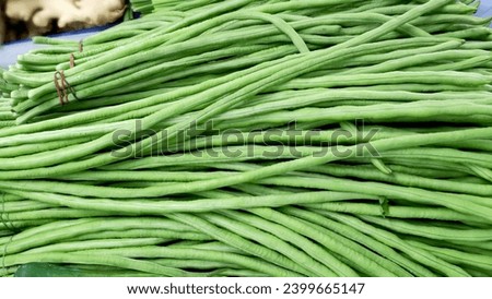 fresh  long beans is sold on the shelves in the fresh market.