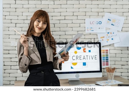 Young asian woman graphic designer working in office. Artist Creative Designer Illustrator Graphic Concept, corporate women in creative marketing team working on project management, looking camera