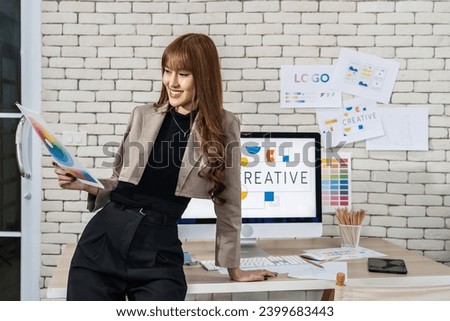 Young asian woman graphic designer working in office. Artist Creative Designer Illustrator Graphic Concept, corporate women in creative marketing team working on project management