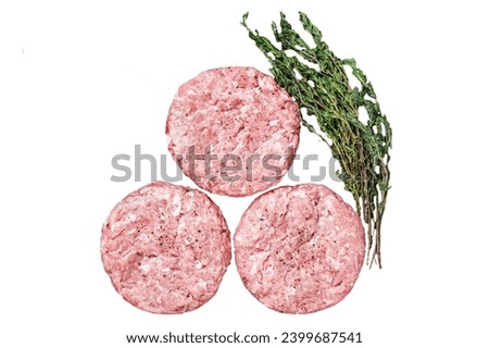 Raw chicken turkey patty, ground meat cutlets on a chopping Board.  Isolated, white background Royalty-Free Stock Photo #2399687541