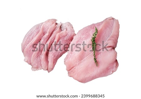 Sliced Raw turkey breast fillet meat on a cutting board with butcher knife.  Isolated, white background