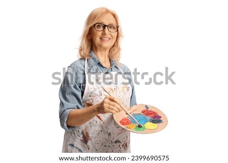 Woman holding a painting brush and palette with acrylic paint isolated on white background