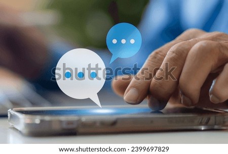 Human hand using smartphone typing Live chat chatting and social network concepts, chatting conversation working at home in chat box icons pop up. Social media marketing technology concept	 Royalty-Free Stock Photo #2399697829