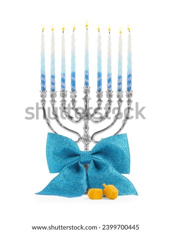 Hanukkah celebration. Menorah with colorful candles, bow and dreidels isolated on white Royalty-Free Stock Photo #2399700445