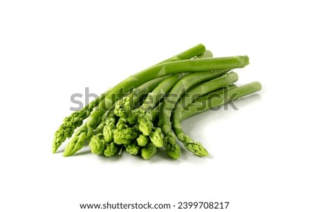 Bunch of Raw Garden Asparagus with Shadow Isolated. Fresh Green Spring Vegetables on White Background. Edible Sprouts of Asparagus Officinalis Top View Royalty-Free Stock Photo #2399708217