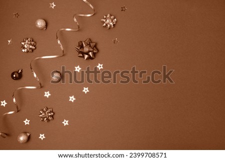 New Year Brown Background. Golden Decoration. Christmas Greeting Card Mockup. Sparkle Baubles. Top view, Copy Space. Gold Balls, Confetti on a Beige Festive Backdrop. Banner Template. Xmas Frame.