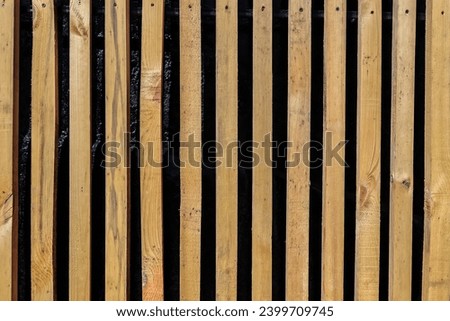 Texture of wooden plank wall background. Seamless pattern of modern wall panels with vertical wooden planks for background