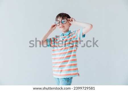 Boy in glasses and striped t-shirt