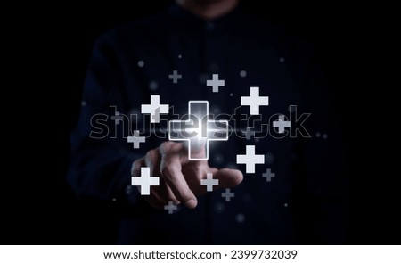 Businessman touching on virtual plus sign for positive thinking mindset or healthcare insurance symbol concept, Mental health care, mental rejuvenation, Insurance, Work welfare, Employee protection, Royalty-Free Stock Photo #2399732039