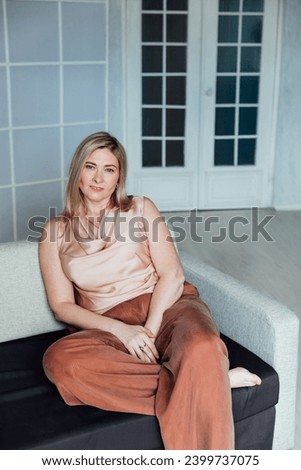 woman sitting on sofa in office