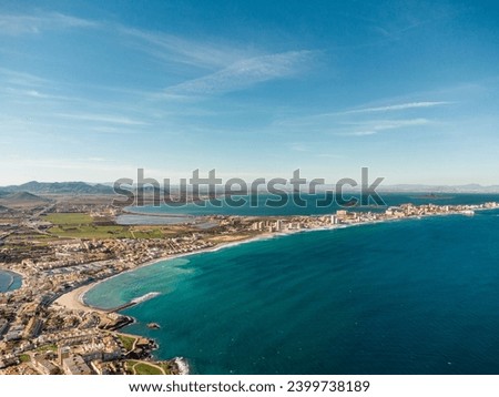 Aerial drone perspective of famous region La Manga, Murcia Province. Spain. "Cabo de Palos" - Cape Palos. La Manga city in background. Beautiful panorama of all region. European Travel Destination