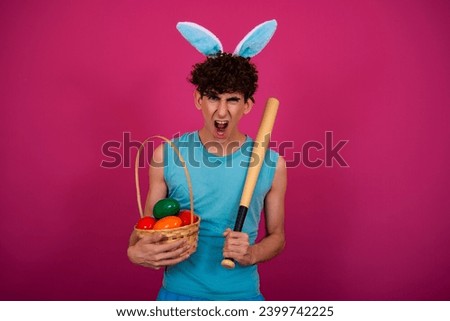 Easter holiday. Funny curly guy in a bunny suit. Pink background.